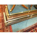 Two late Victorian brass and cast iron fire kerbs with low pole galleries,