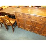 An oak draw leaf refectory table on an H base and sledge feet, 107cm long, 75cm wide,