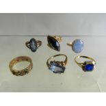 A 9ct gold opal set ring together with a cameo set ring, a faceted pyrite ring,