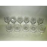 A suite of matching cut glass wares to five trays including tumblers, white wines, red wines,