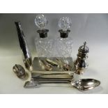 Two silver mounted glass decanters together with a silver cigar box with engine turned decoration,