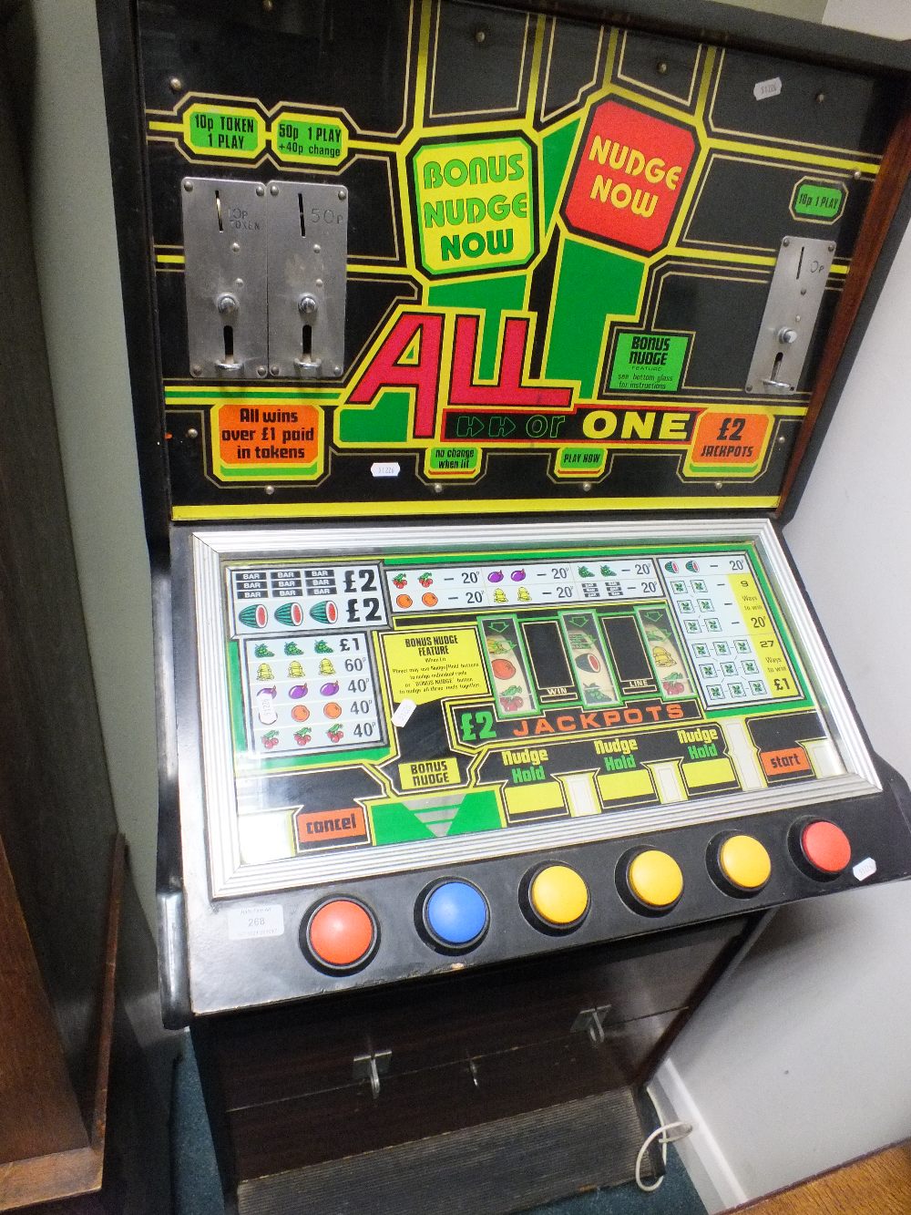 An All or One' Jackpot slot machine in simulated rosewood case with buttons for 'Cancel' 'Bonus