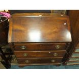 A George III mahogany fall front bureau with fitted interior above three long graduated drawers on