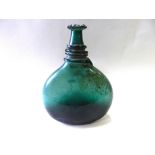 An emerald glass saddle flask,