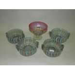 A set of four Venetian latticino glass dessert bowls internally decorated with alternating bands