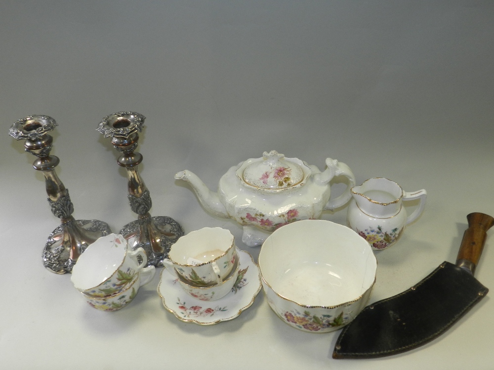A florally decorated early 20th century partial tea service,