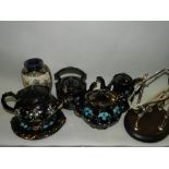 A selection of 19th century jet black earthenware ceramics to include hot water jug with pewter