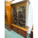 A mahogany book case top with two astragal glazed doors enclosing adjustable shelves on an