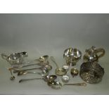 Electroplated wares including a sauce boat, a Channel Islands type jug, napkin rings,