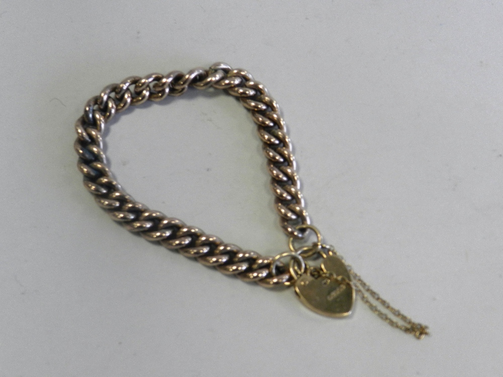 A gold plated curb link bracelet with 9ct gold heart shape clasp