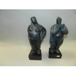 Two patinated green bronze models of plump ladies in the nude