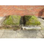 A pair of large stone gatepost pediments, each of square form low pyramid,