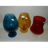 Eight assorted coloured glass table centre pieces in the form of large brandy balloons