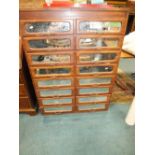 A set of late Victorian/Edwardian stained pine mirror front shop counter drawers in two rows of