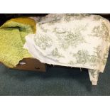Two boxes of fabric including yellow Durham quilt style throw, patterned curtain fabric etc.