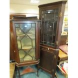 An Edwardian mahogany and satinwood crossbanded corner cabinet on stand with astragal glazed door,