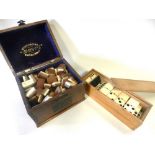 A cased mahjong set the bone and bamboo pieces in an oak box together with a cased dominoes set