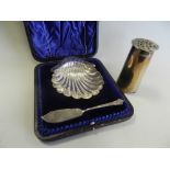 A cased silver butter dish in the form of a shell together with a silver pounce pot