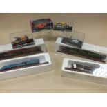 A mixed group of boxed vehicles to include eleven boxed motorcycles, five model trains,