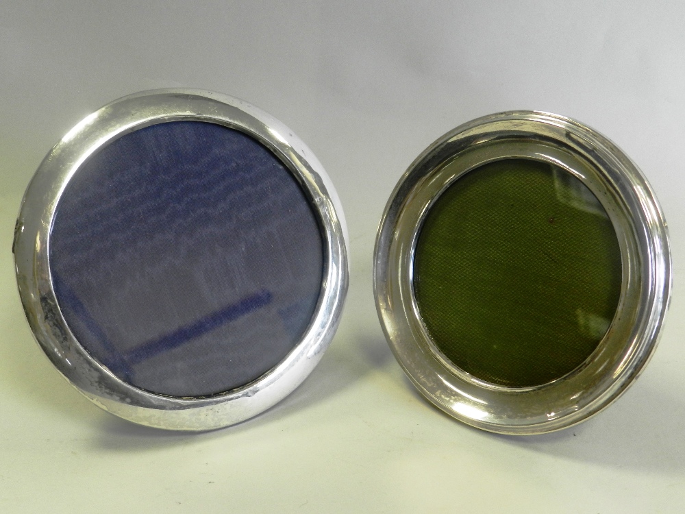 Two silver mounted circular frames