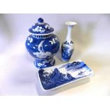A Chinese blue and white ginger jar and cover decorated with the prunus pattern together with a