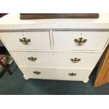 A white painted pine chest of two short and two long drawers on bun feet, 90cm wide, 49cm deep,