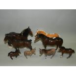 Two Beswick donkeys, a Beswick brown gloss foal, Beswick Palomino horse,