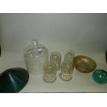 A carnival glass style bowl, glass domes, a pair of green and white lamp shades,