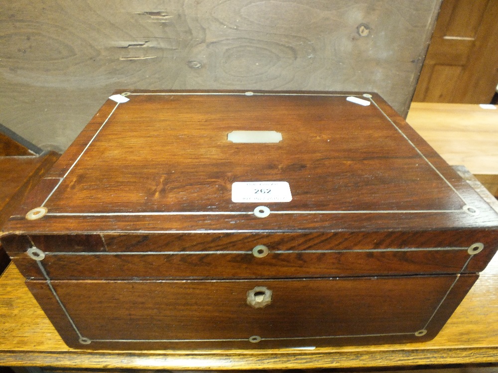 A Victorian rosewood and pewter strung work box with pull out tray to the interior covered in Mabel