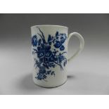 A first period Worcester porcelain mug printed in blue with botanical sprays,