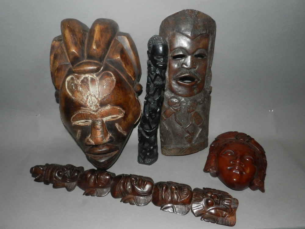 20th century Africa tribal masks and two carved figures