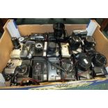 A quantity of compact roll film cameras