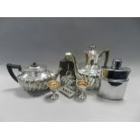 A circular embossed copper tray, a silver plated cruet stand, various bone handled flatware,