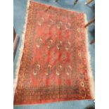 A Caucasian red ground rug,