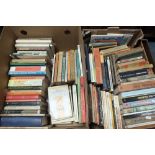 Two boxes of hard and paper back books, mostly novels,