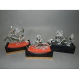 Three Swarovski crystals sculptures, the Unicorn 1996, the Dragon 1997,