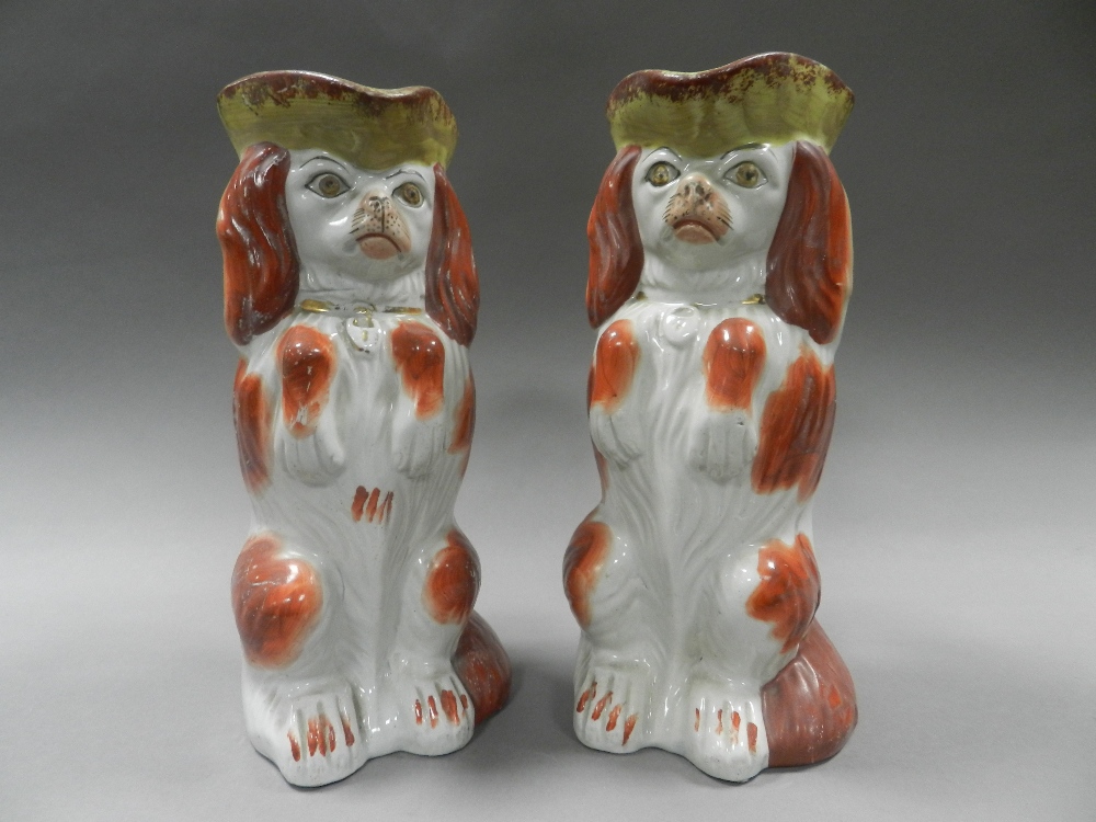 A pair of Staffordshire 'begging dog' toby jugs