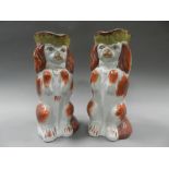 A pair of Staffordshire 'begging dog' toby jugs