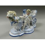 A KPM Berlin porcelain figure group of putti with chariot drawn by a ram