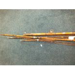 A Milbro Goliath split cane two piece fly rod and two three piece fly rods and canvas case