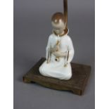 A figural table lamp,