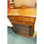An Edwardian mahogany and inlaid glazed front music cabinet with frieze drawer above a single