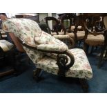 An early Victorian mahogany framed open armchair later upholstered scroll arms on squat leaf