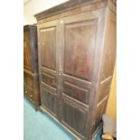 A George III mahogany gentleman's two door wardrobe, Channel Islands, circa 1800,