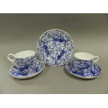 A quantity of Royal Crown Derby porcelain coffee cups, saucers and plates,