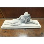 A French Sevres Vinsare slip cast pottery model of an Art Deco style naked lady and faun 57cm long,