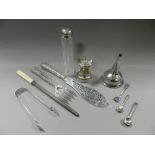 A silver fish server and fork together with a pair of silver sugar tongs,