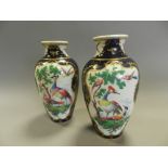 A pair of early 20th century Samson Worcester porcelain style vases decorated with exotic birds