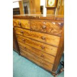 A Victorian tall figured mahogany chest of two short and four long graduated drawers with knob
