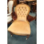 A Victorian walnut spoon back nursing chair with later upholstered button back and seat